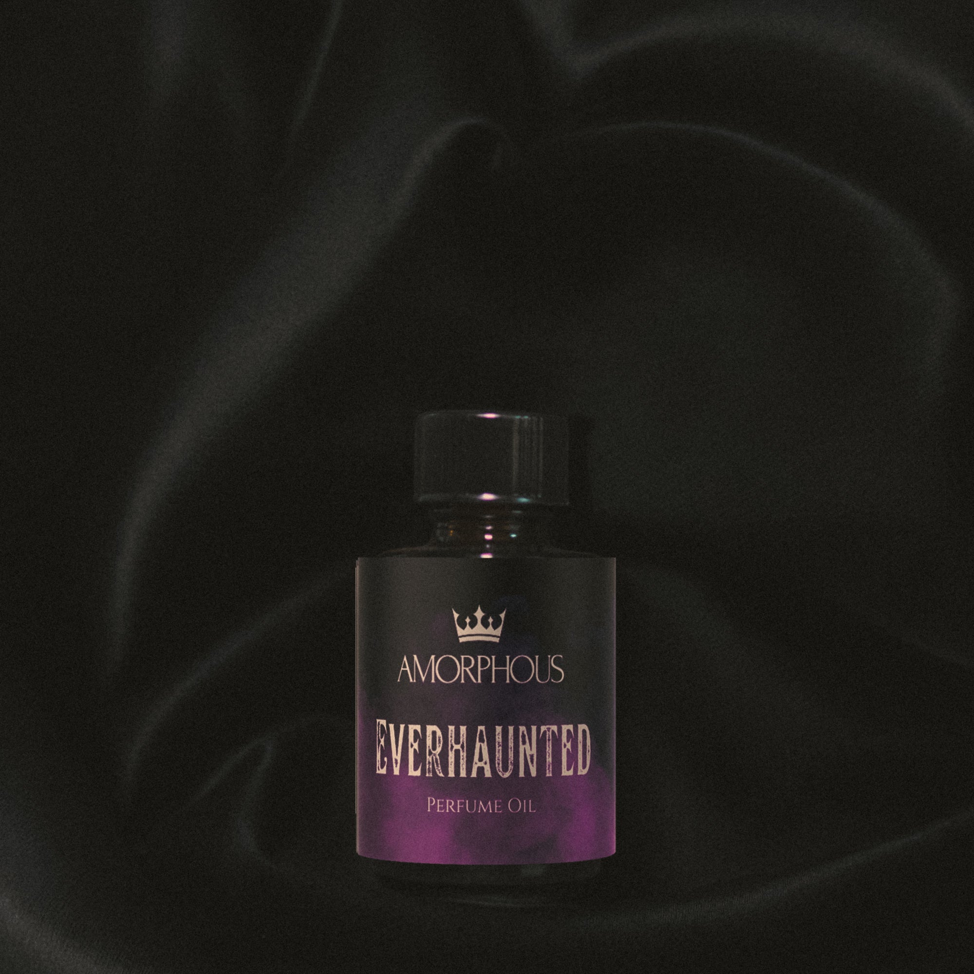 Perfume oil bottle labeled 'Amorphous Everhaunted' on a dark background