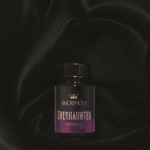 Perfume oil bottle labeled 'Amorphous Everhaunted' on a dark background