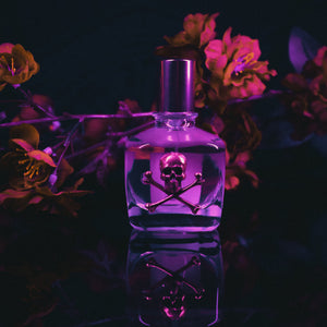 Bottle of Amorphous Vena Cava perfume oil with a dark background